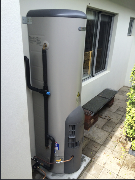 Plumber Melbourne servicing an external heat pump hot water system